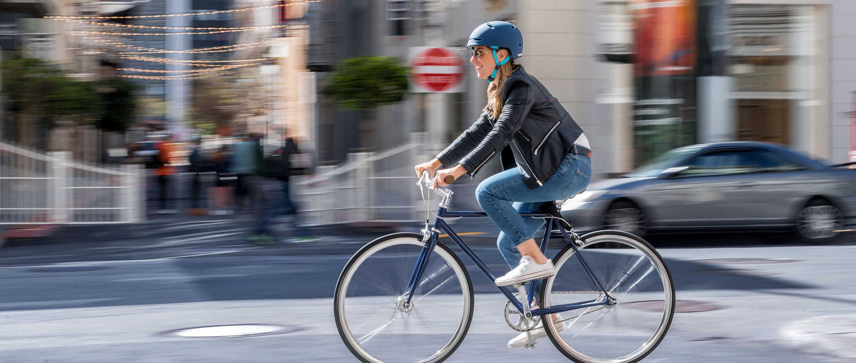 Abus girl in a bicycle with helmet